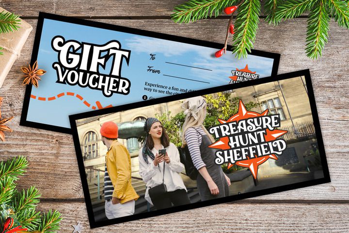 A gift voucher for Treasure Hunt Sheffield on a table covered with Christmas decorations
