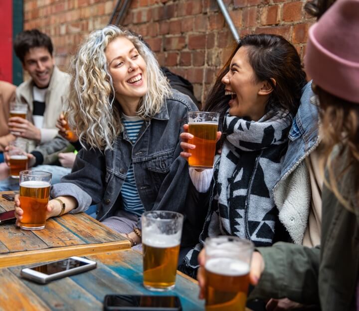 Friends enjoying a drink together while playing Treasure Hunt Sheffield