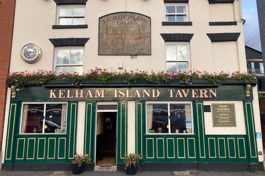 Green exterior of the classic pub, Kelham Island Tavern. Recommended by Treasure Hunt Sheffield.