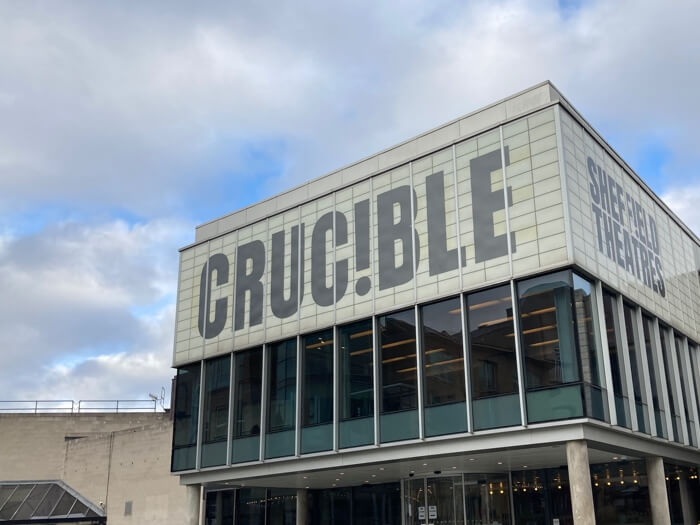 The distinctive front of the Crucible Theatre in the sunshine