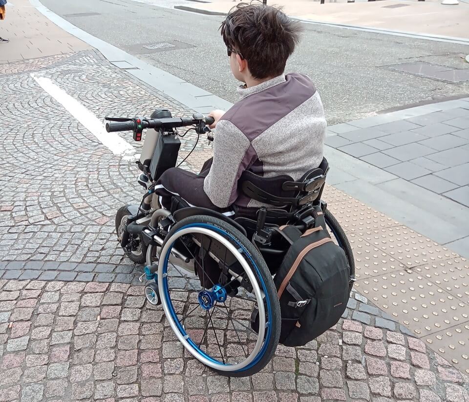 A young man using a powered front-wheel wheelchair playing Treasure Hunt Sheffield